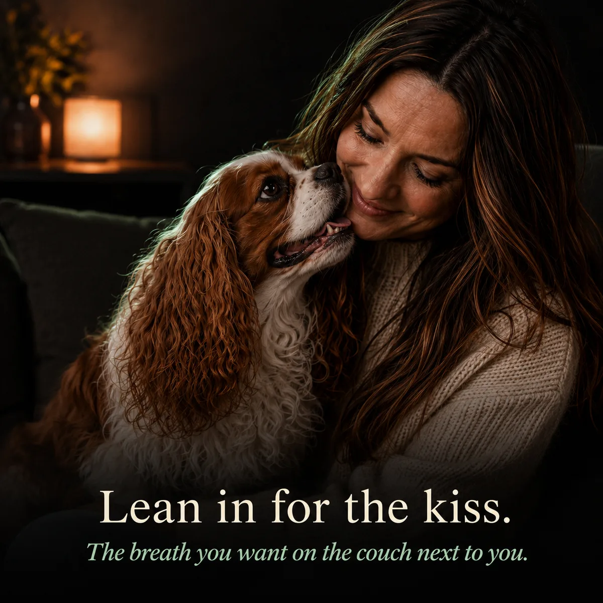 Lean in for the kiss: woman nose-to-nose with her happy Cavalier, the breath you want on the couch next to you